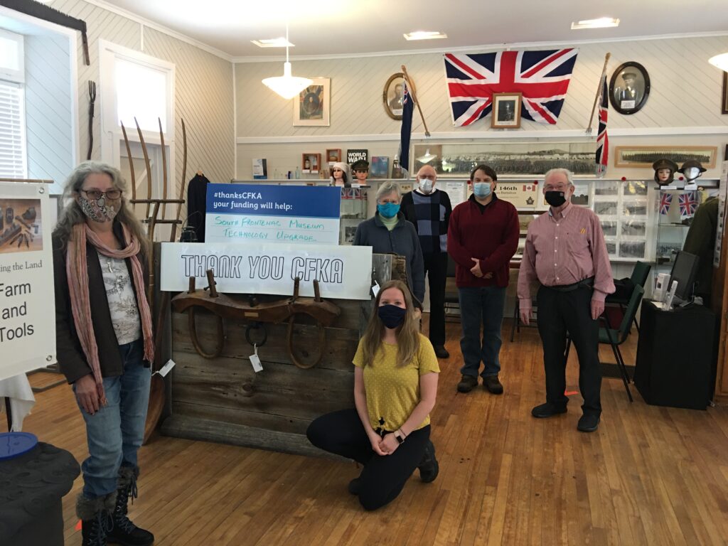 Museum Society Members with thank you CFKA sign