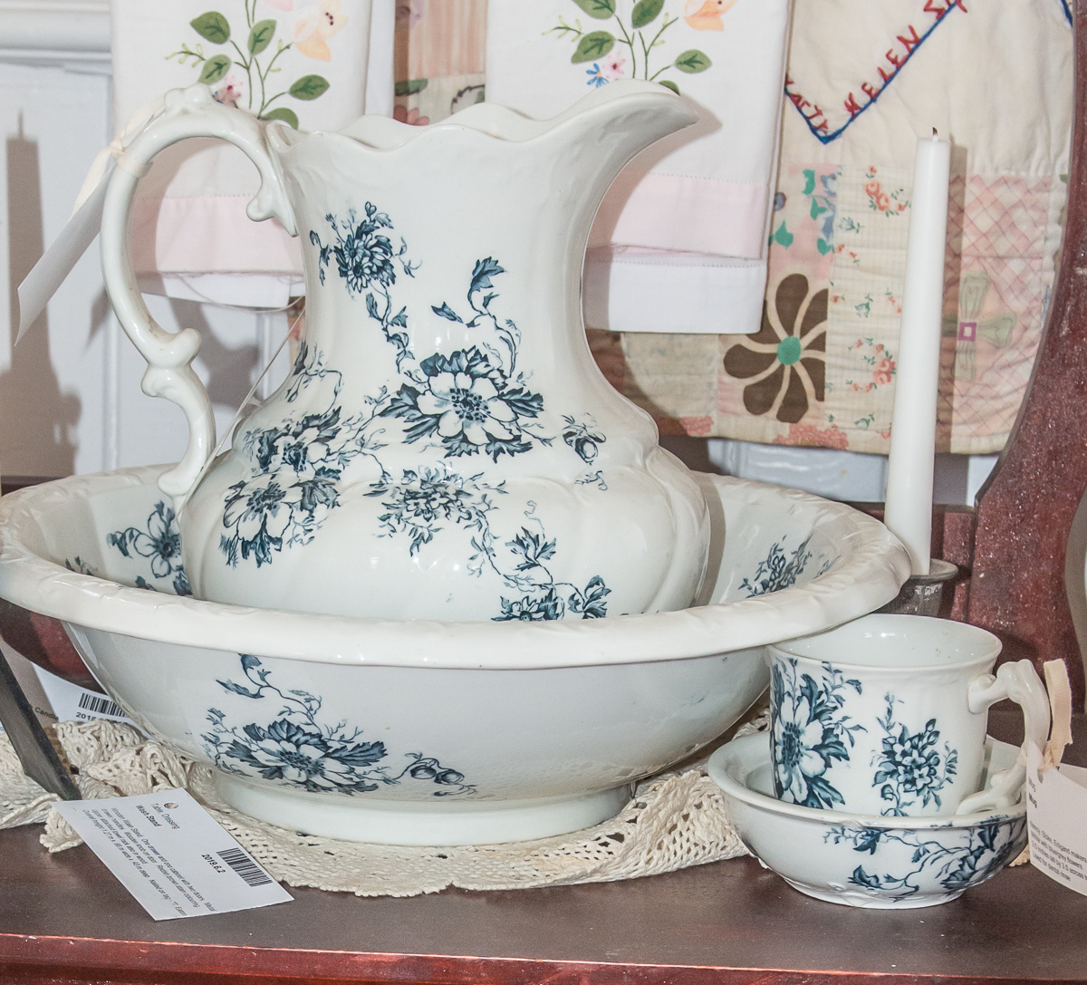 Vintage blue and white ceramic pitcher with matching bowl and cup.