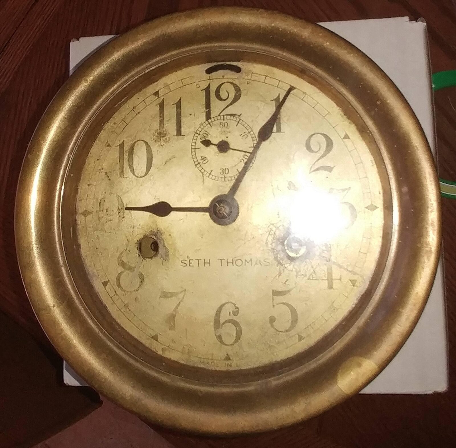 Antique brass Seth Thomas wall clock.